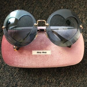 Miu Miu sunglasses with hearts in lenses